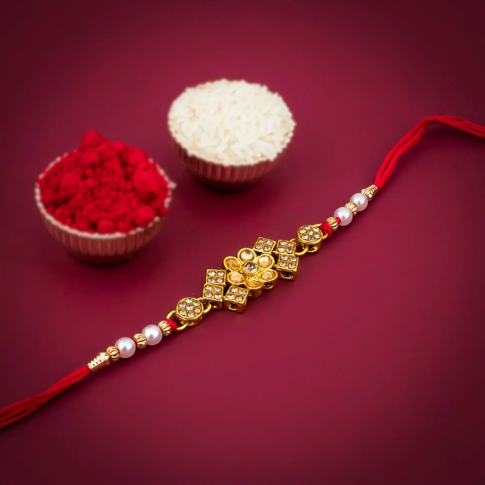 Sukkhi Blossomy Gold Plated Floral Rakhi with Roli Chawal and Raksha Bandhan Greeting Card For Men